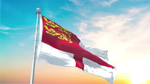 Guernsey Flag Waving Against Dynamic Sky