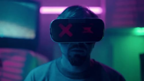 Man Taking off VR Headset with Prosthetic Hand