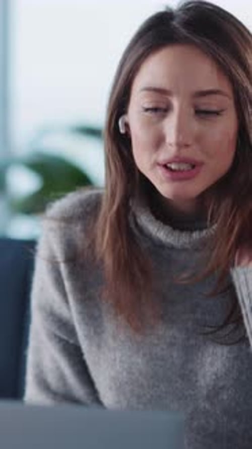 Woman on a Video Call Using her Laptop