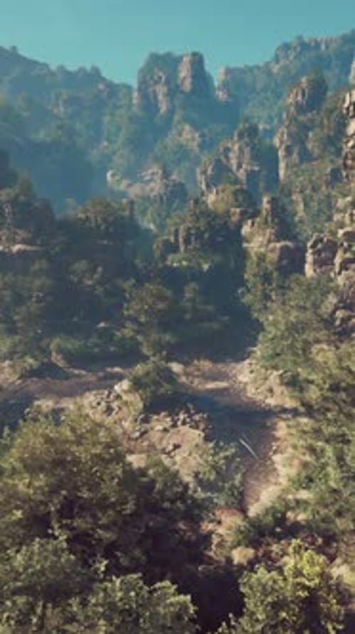 A Scenic View of a Mountain with Trees and Mountains in the Background