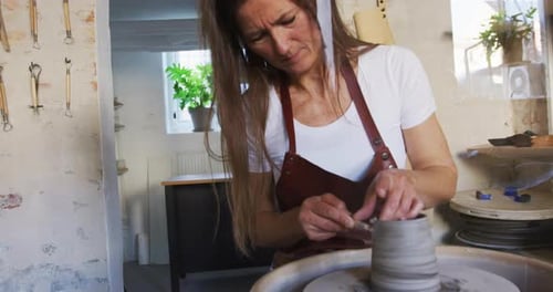 Creative Woman Working in Shop Making Pottery. Small Shop Owner Adults