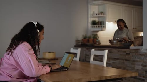 Teen Girl Working on Laptop at Home