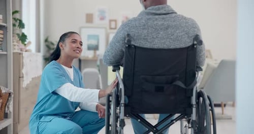 Woman Healthcare Worker With Elderly Man In Wheelchair