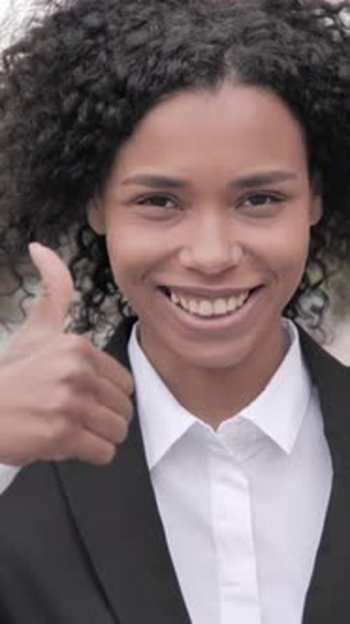 Thumbs Up by African Businesswoman Standing Outdoor by Road, Vertical Video