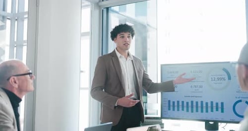 Talking, presentation and man in meeting, financial agency and graphs for company revenue