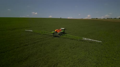 Spray Fertilize On Field With Chemicals In Agriculture Field