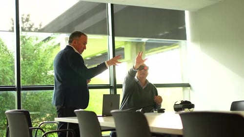 Businessman Presenting a Innovative Mixed Reality Goggles to a Client