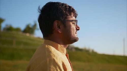 Indian Man Enjoying Nature in a Field