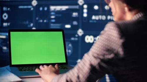 Woman Big Data Analyzing Working Laptop with Green Screen Chroma Key Futuristic Virtual Infographic