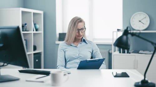 Tired Woman in Office