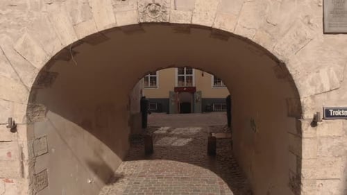 Swedish gate in old town Riga, Latvia, aerial drone flying backwards