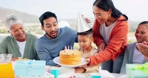 Family, birthday party and cake with celebration, happiness and outdoor with joy