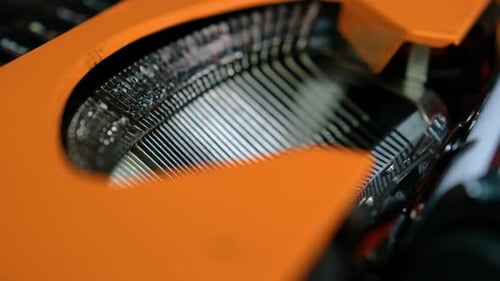 Writing letters with orange retro vintage typewriter