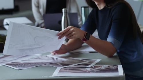 Environmental Activists Discussing Topographic Maps In Meeting