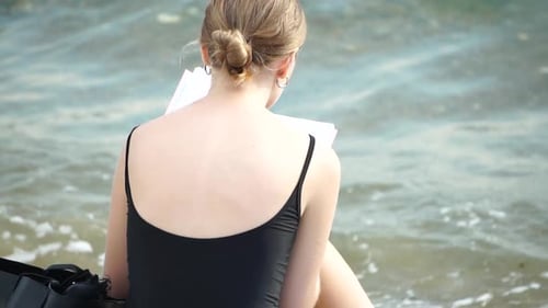 Woman Reading Book and Sitting on the Beach on Vacation Summer Holidays Travel Concept Summer Chill