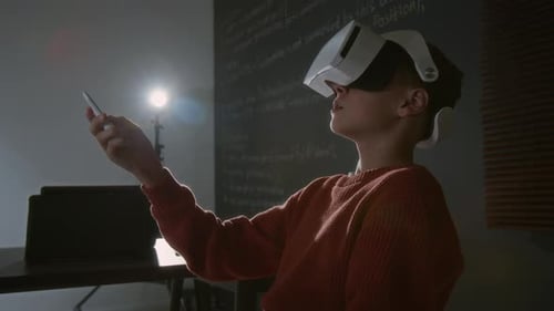 Teen Using VR Headset and Handheld Controller