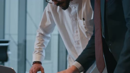 Diverse Businessmen Meeting at Office to Discuss Working Tasks