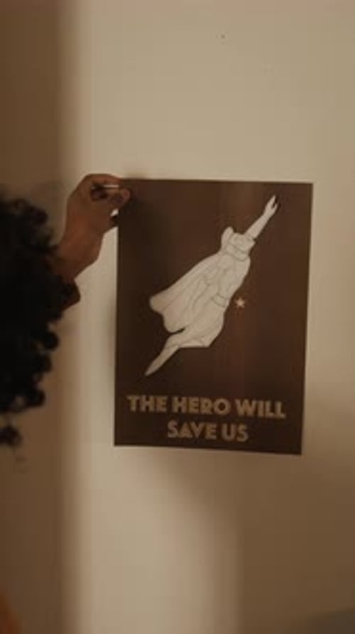 School Student Replacing Comics Poster on Wall with Lesson Timetable