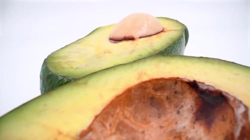 Cut avocado macro on white background isolated 4K