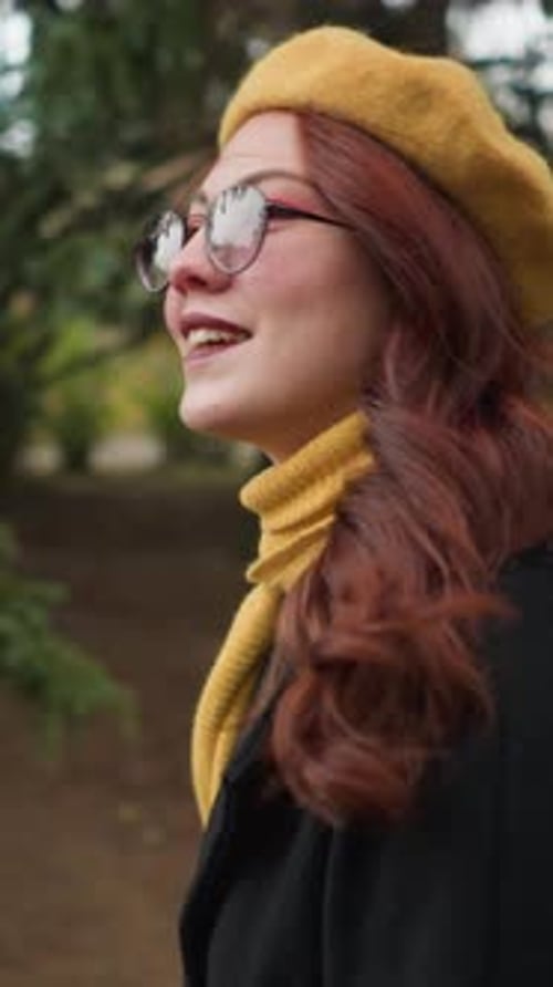 Joyful Walk College Student with Yellow Beret Adjusts Sunglasses