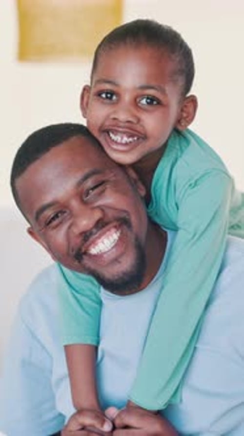 Loving Father and Daughter Smiling Together Indoors