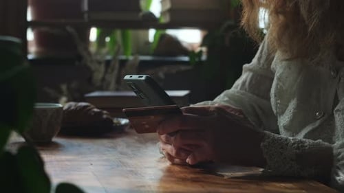 Online Payments Woman Using Bank Card and Smartphone to Transfer Money Online