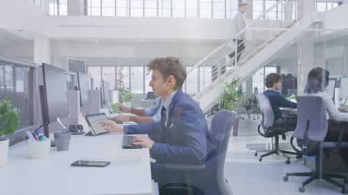 Teamwork in bright modern office environment with coworkers