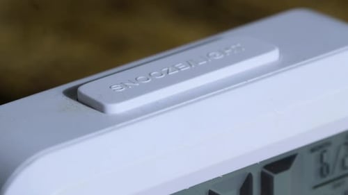 Close Up of Digital Alarm Clock Snooze Button