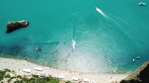 Aerial Panoramic View of Seascape with Crystal Clear Azure Sea and Rocky Shores