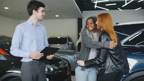 Salesman Gives Car Keys to Two Excited Women