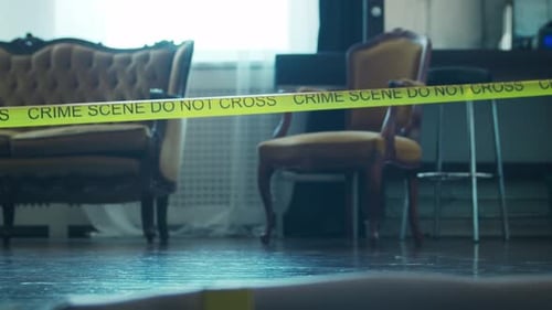 Crime Scene Tape and Evidence Markers Indoors
