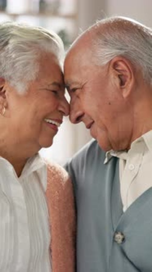 Senior Couple Sharing Sweet Moment Together Indoors