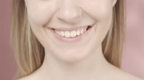 Healthy Beautiful Female Smile Close Up Dental Health Whitening Prosthetics and Care Slow Motion HDR