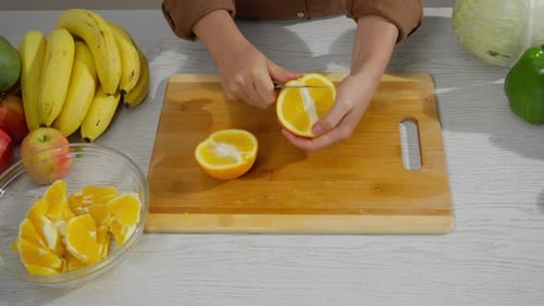 Demonstrating simple fruit slicing techniques