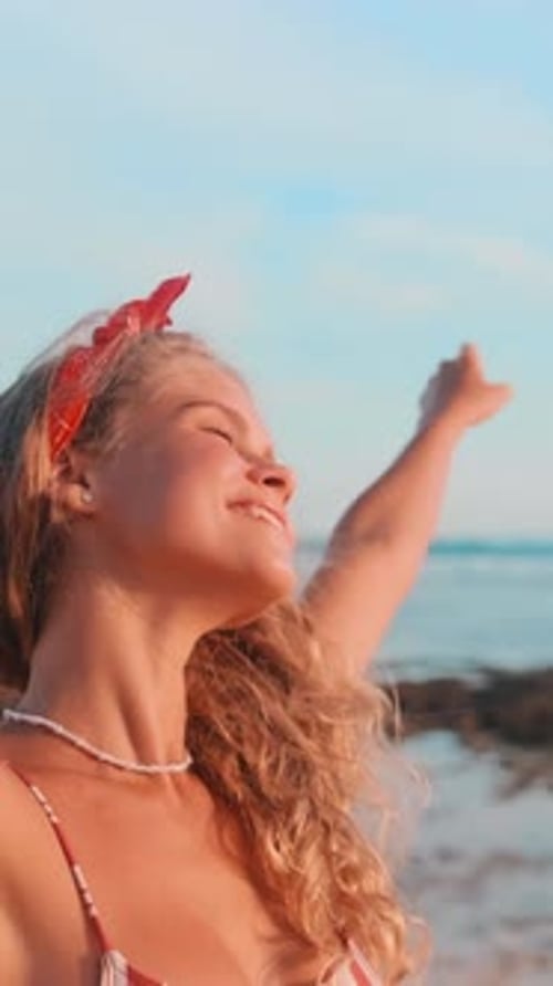 Enjoying Blissful Moments By the Sea With Joy and Laughter on a Sunny Day