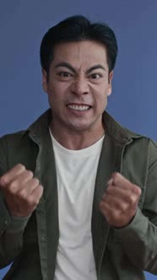 Furious Man Showing Anger on Camera, Vertical