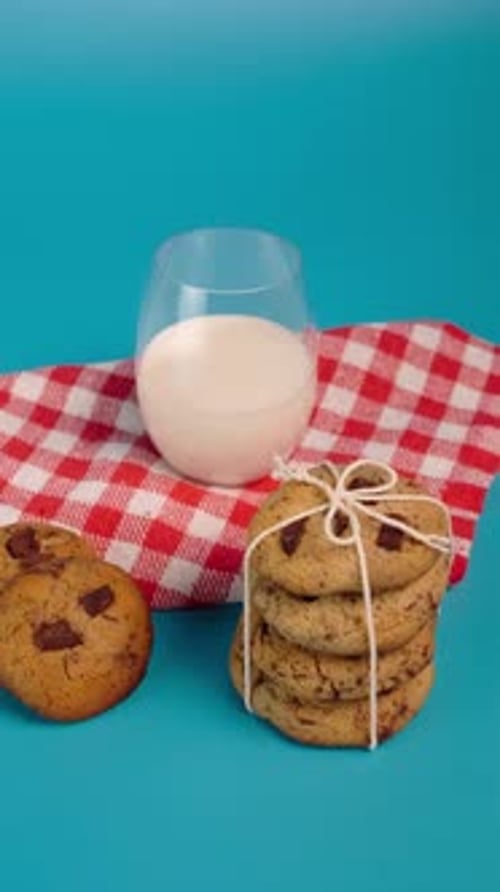 Vertical Video, Chocolate Chip Cookies With A Glass Of Milk On The Back