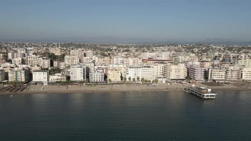 Aerial retreats from Durres Albania beach restaurant pier waterfront
