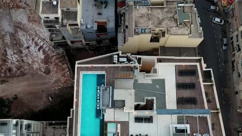 Aerial view of buildings and pool, Malta.