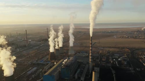 Aerial View of Thermal Power Plant Drone Flies Over Chimney Smoke Pipes and Cooling Towers of