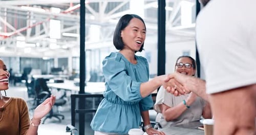 Successful Business Handshake with Applauding Colleagues in Office