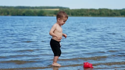 Summer child having fun on a river. Water summertime lifestyle.