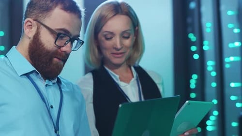 IT Professionals Working Together in Data Center