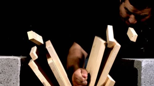 Fist Smashing Wooden Slats in Slow Motion