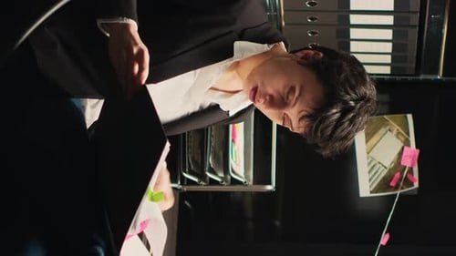 Young Woman Working on Project in Office