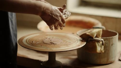 Unrecognized Female Master Sculpting Clay in Workshop. Closeup Woman Hands Modeling Clay