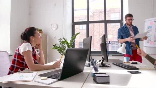 Business, Technology And People Concept - Man Showing User Interface Design On Flip Chart To Crea...