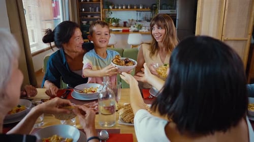 Family Sharing Food Together at a Home Dinner Table