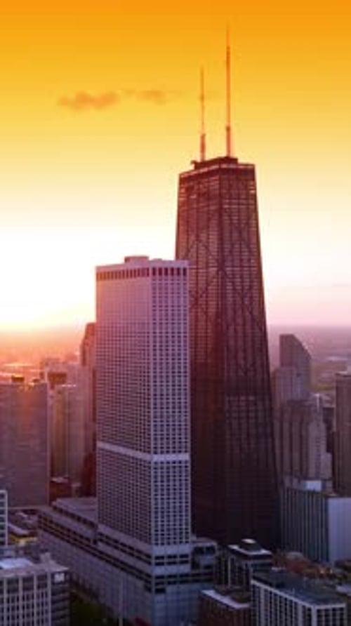 Beautiful Chicago panorama against wonderful orange sky. View of the city from aerial perspective