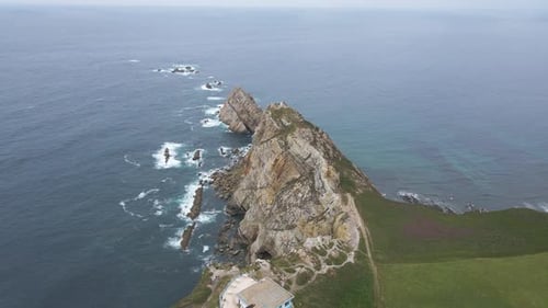 Aerial view of Asturias coastline. Drone shot of sea, cliff, rocks and the Atlantic ocean in Spain.